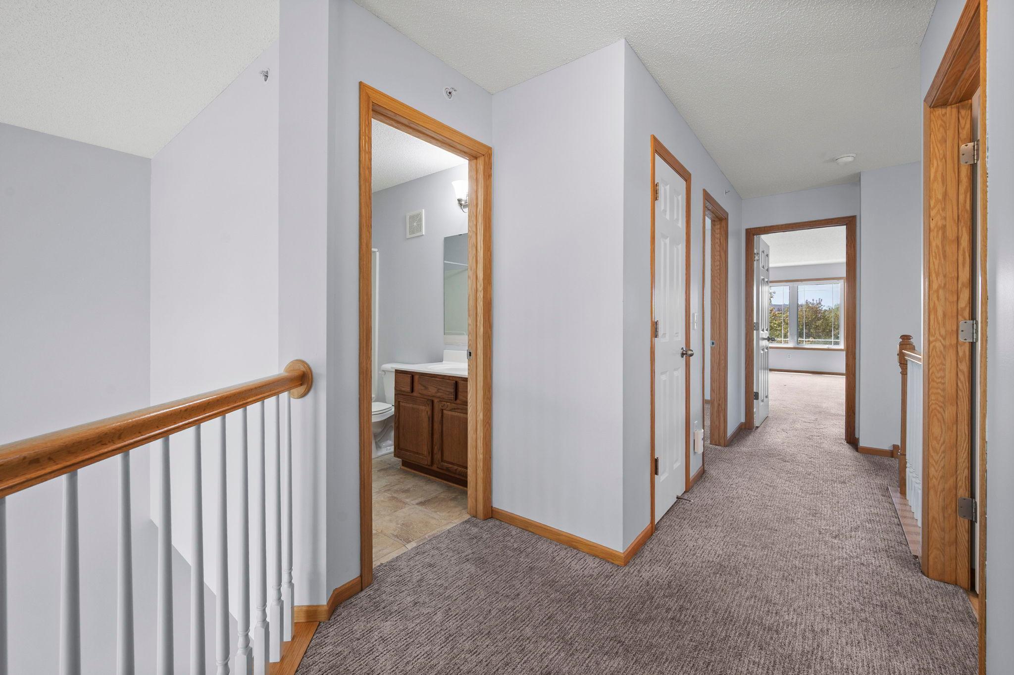Conveniently located upper-level laundry and storage areas are easily accessible from all bedrooms.