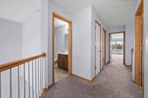 Conveniently located upper-level laundry and storage areas are easily accessible from all bedrooms.