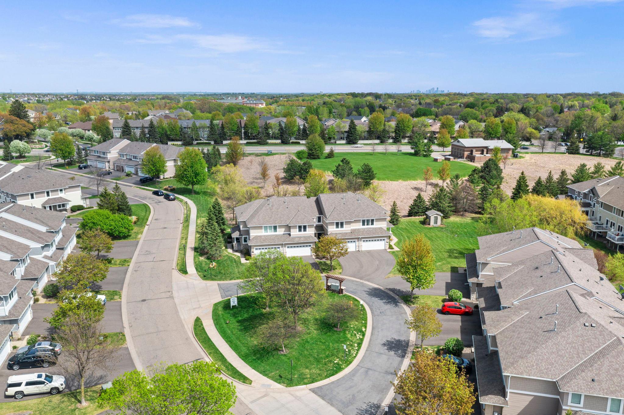 Top-down view of the charming cul-de-sac and the home's prominent position within the community.