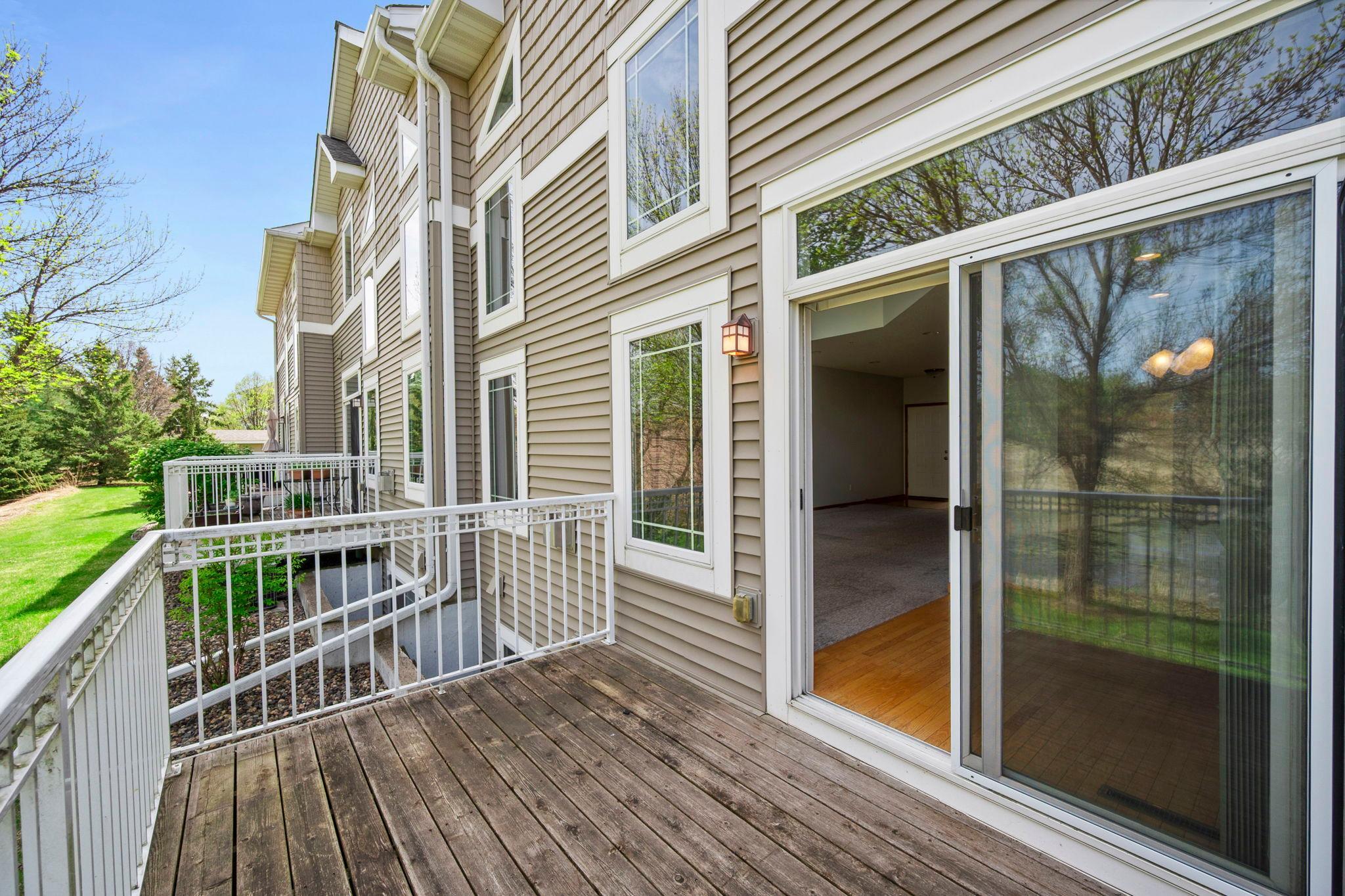 The deck is easily accessed through sliding glass doors from the dining area, perfect for outdoor entertaining.