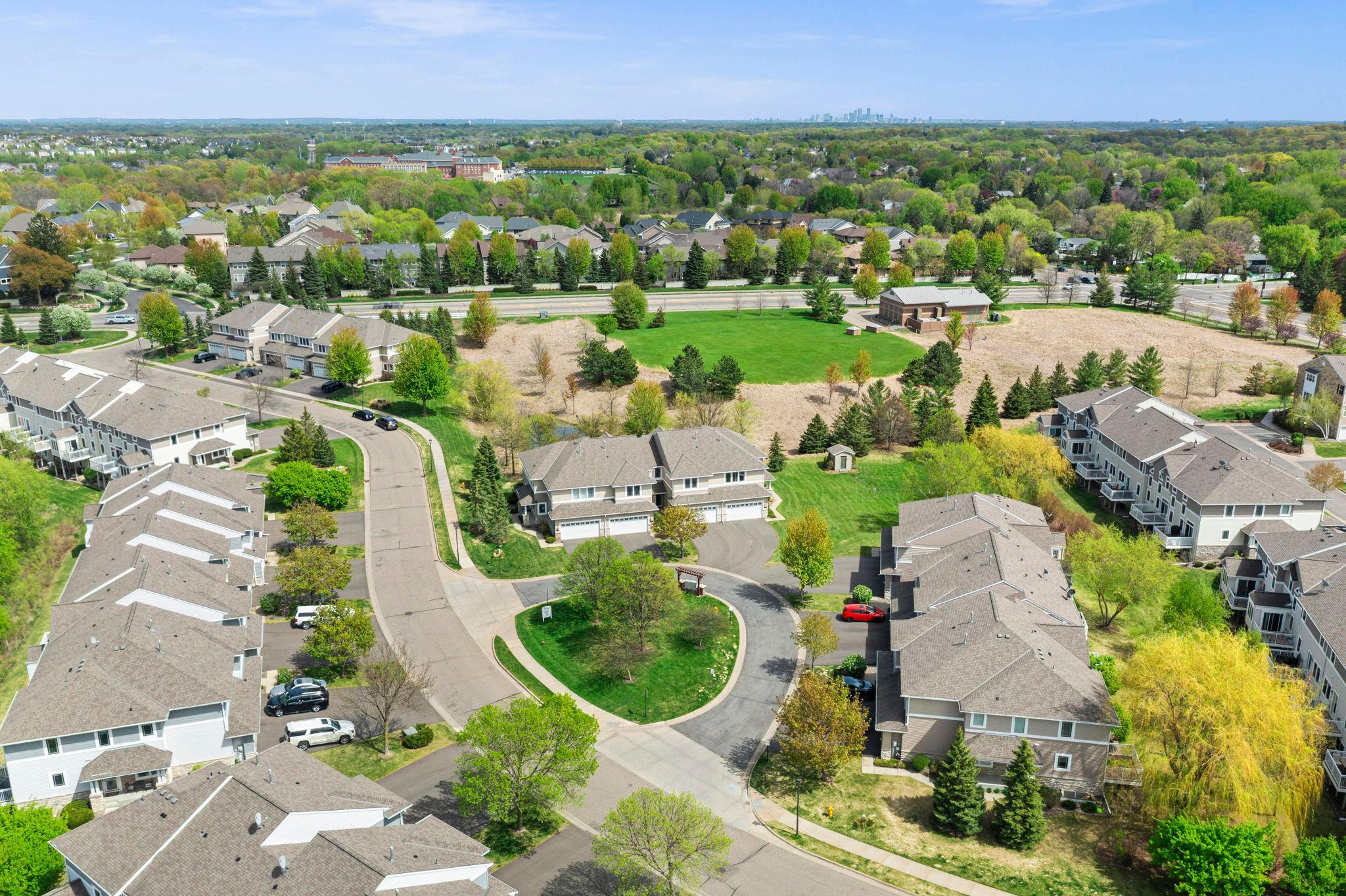 Wide aerial shot capturing the peaceful environment and the skyline in the far distance.