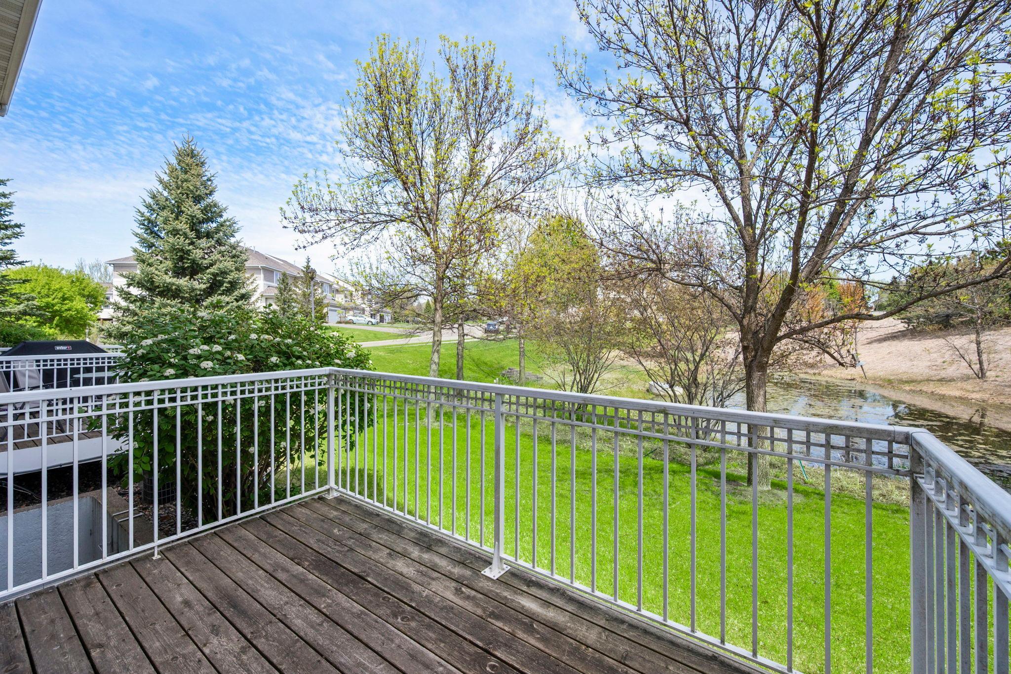 This tranquil outdoor space offers a peaceful retreat with mature trees and professional landscaping.