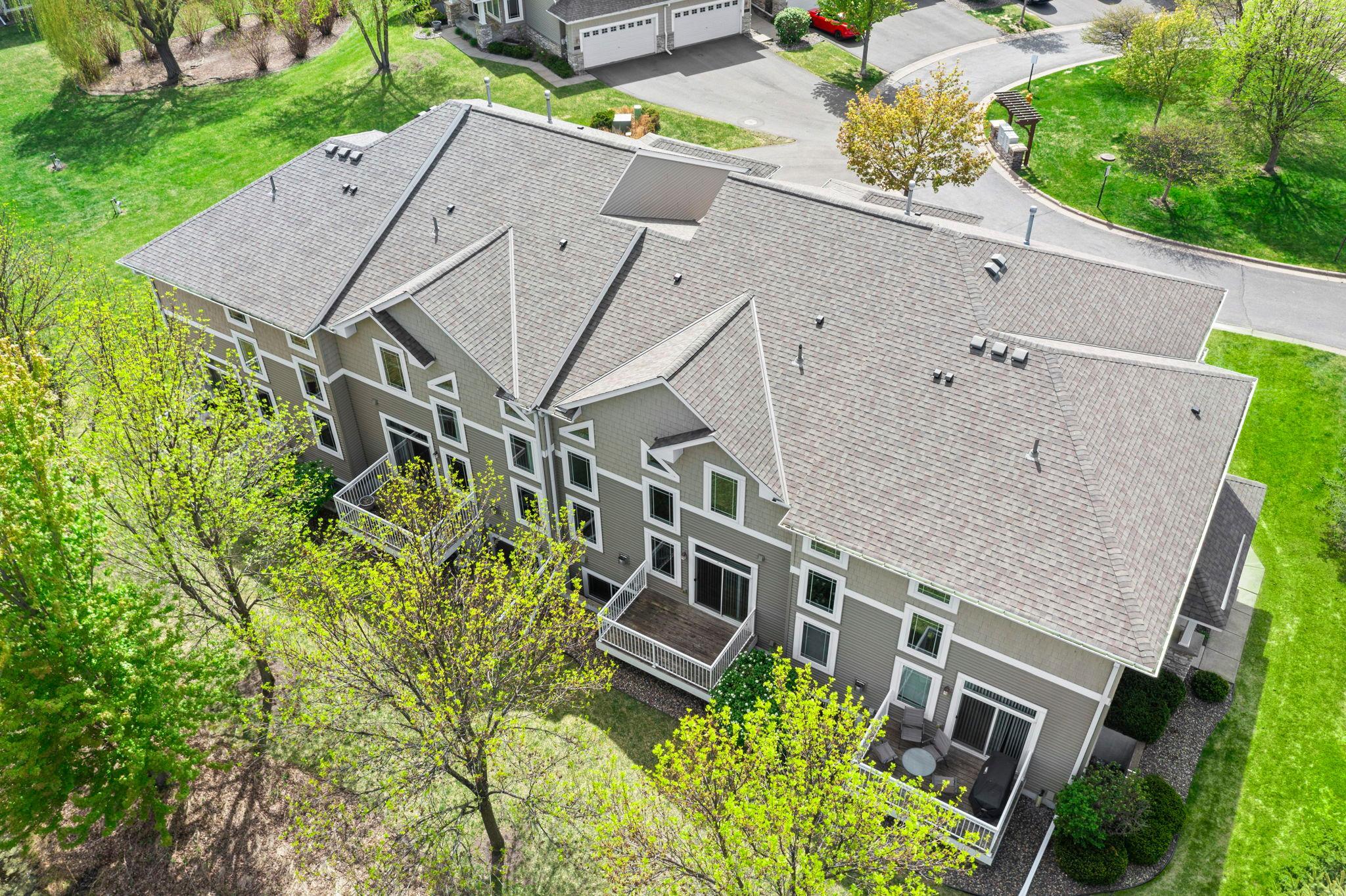 High-angle shot illustrating the layout of the complex and the proximity to adjacent green buffer zones.