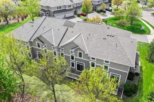 Aerial view highlighting the architectural harmony and expansive green lawns shared by the community residents.