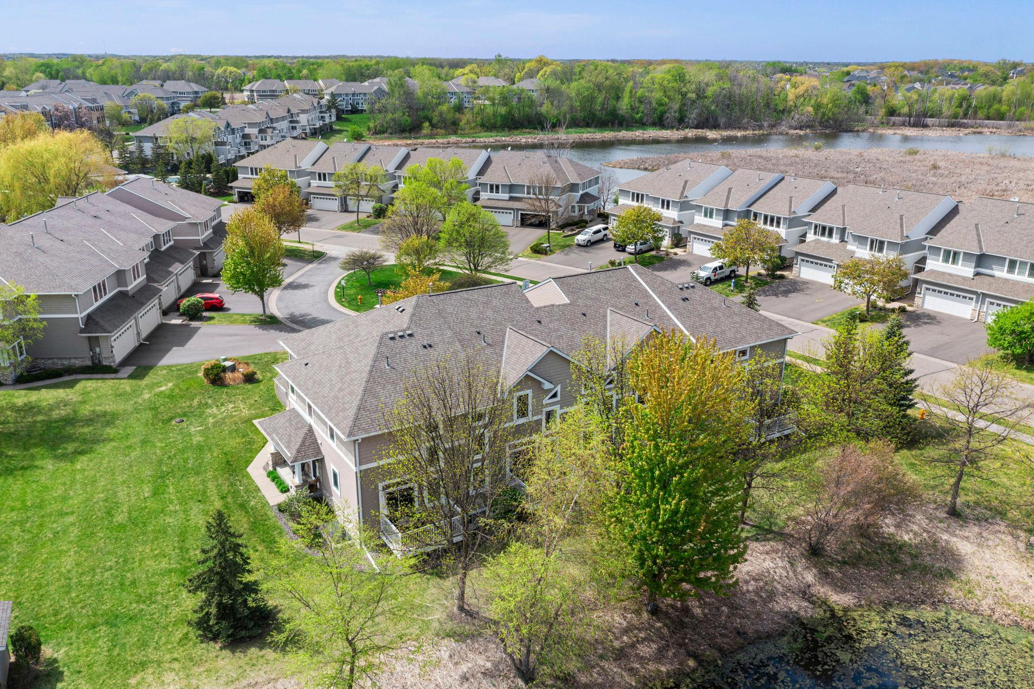 Multiple windows throughout the home capture the vibrant colors of the changing seasons in this lush community.