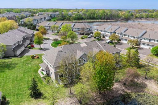 Multiple windows throughout the home capture the vibrant colors of the changing seasons in this lush community.