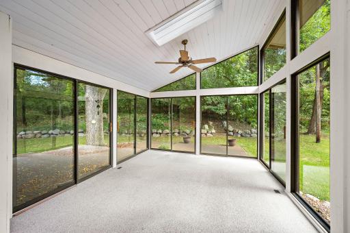 Large 3 season porch with multiple sliding doors. (not included in finished square feet)