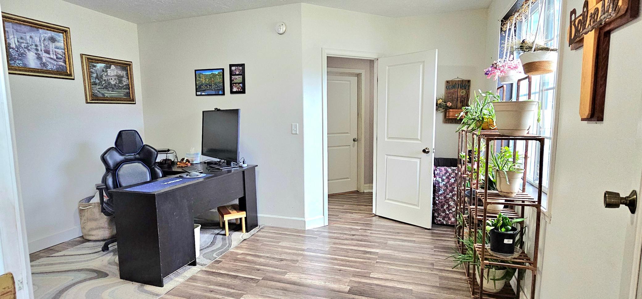 Main floor home office/bedroom *NEW FLOORING