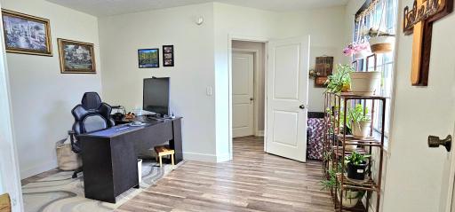 Main floor home office/bedroom *NEW FLOORING