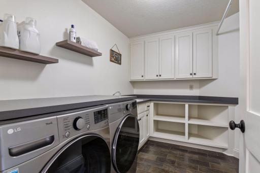 Upper level laundry room with tons of storage