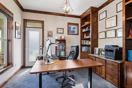 Main floor office with built-ins and a private entrance