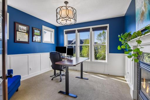 Main floor flex/office with see through fireplace
