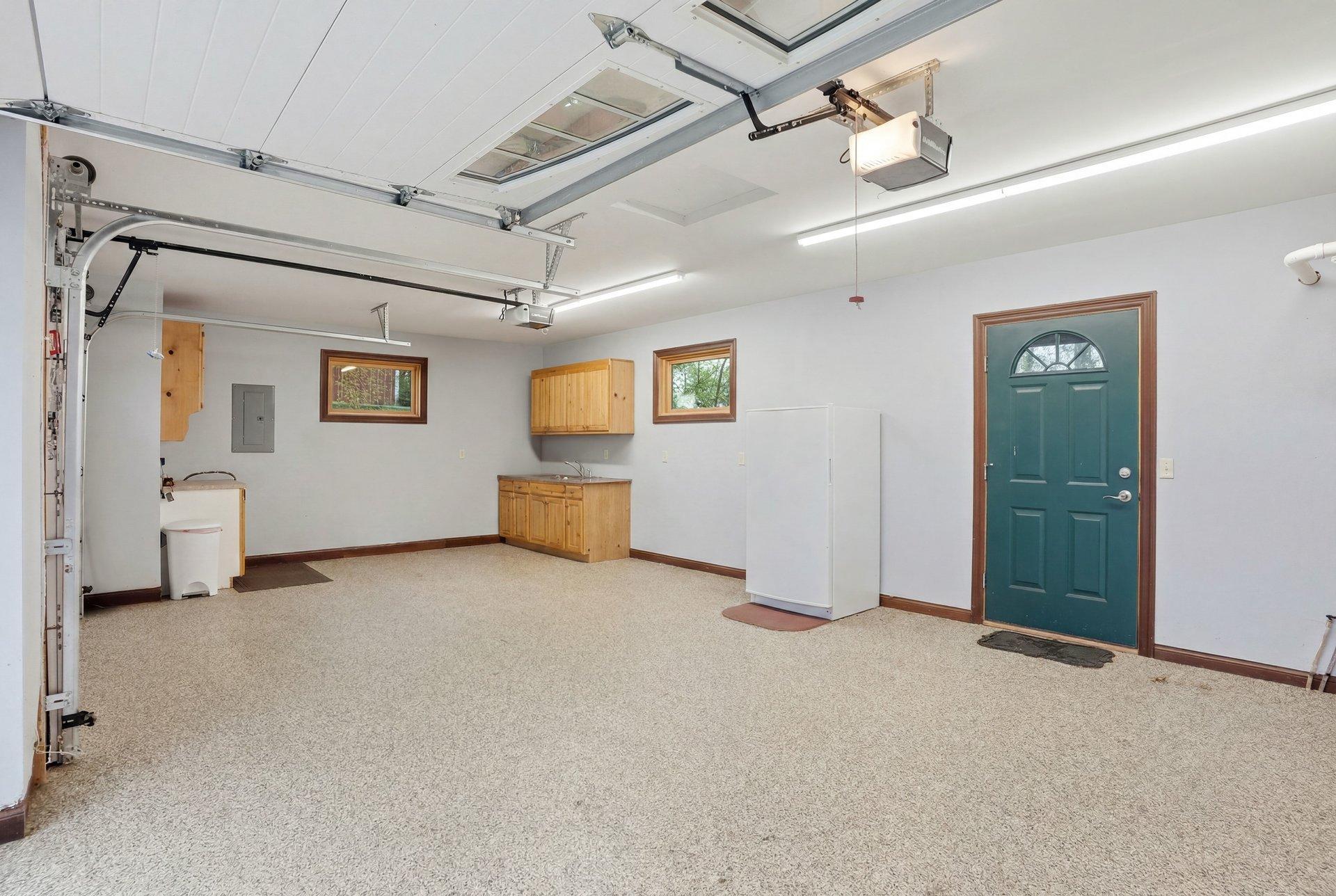 Attached garage is so clean with epoxy flooring and in floor heat