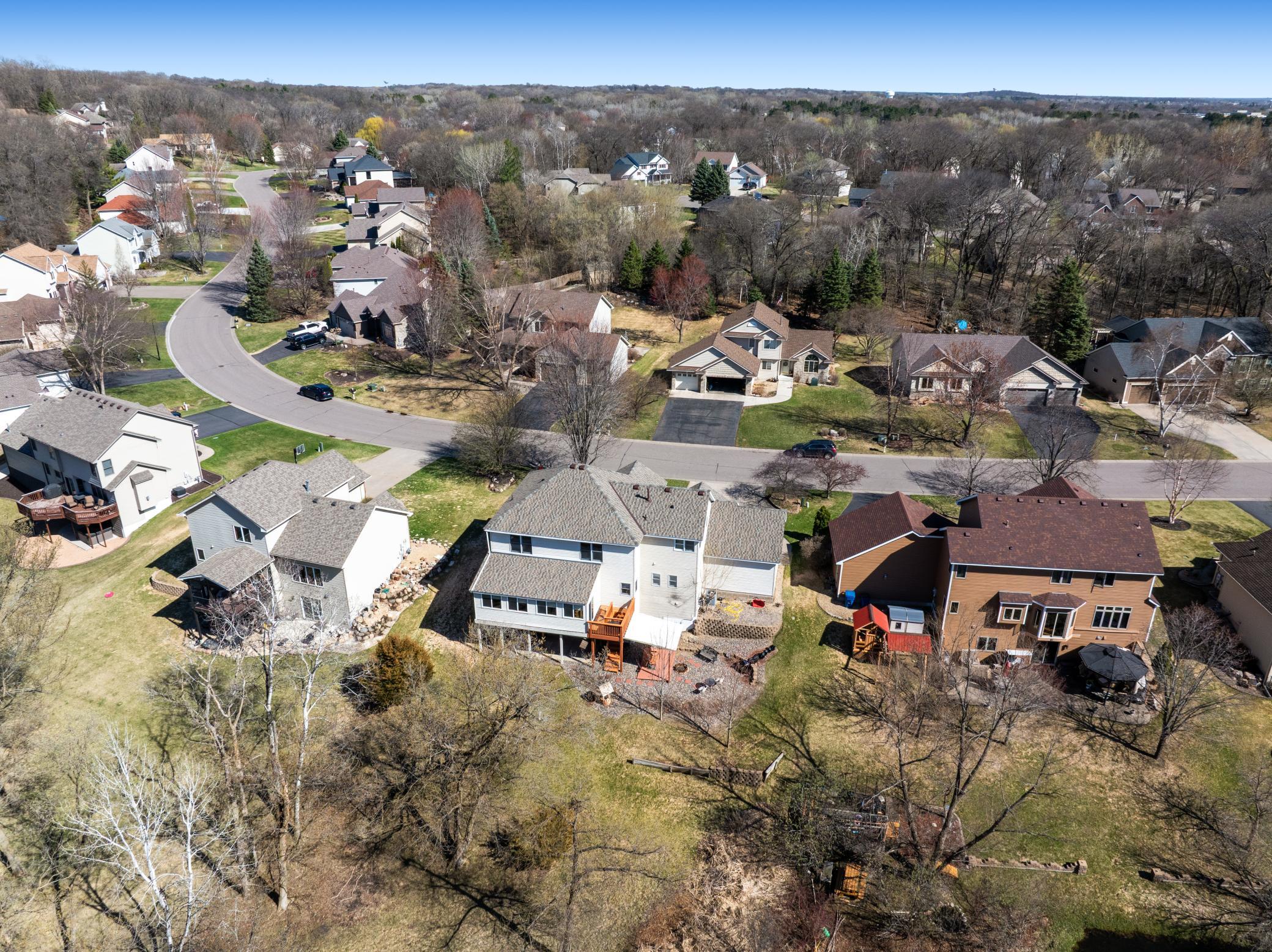 Views of the back of the home and private backyard