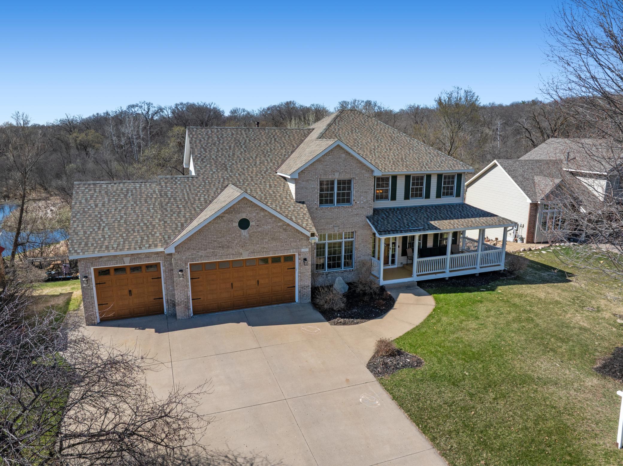 Updated garage doors with concrete driveway