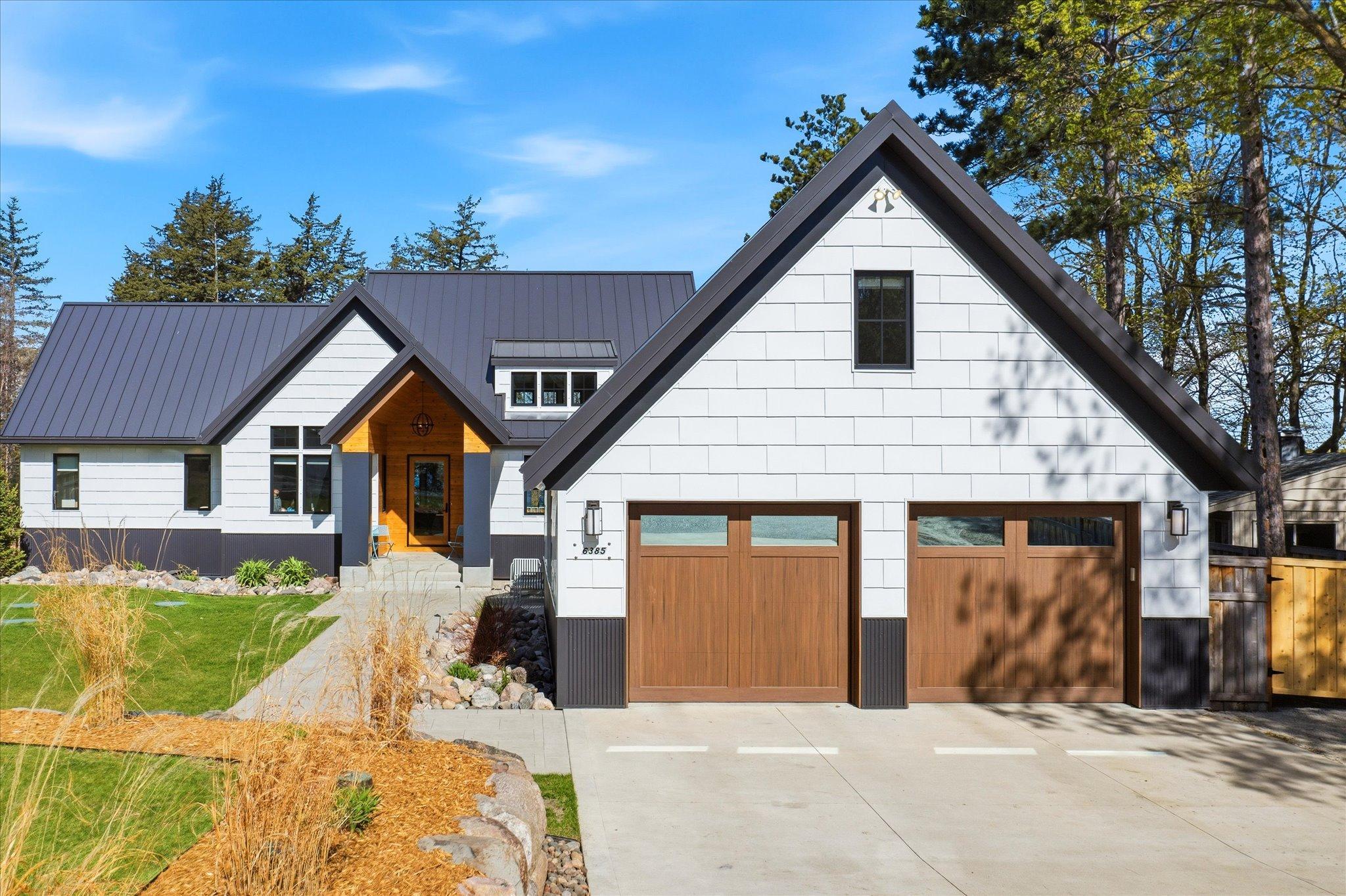 This stunning, nearly new custom-built residence offers refined lakeside living on East Lake Sylvia!