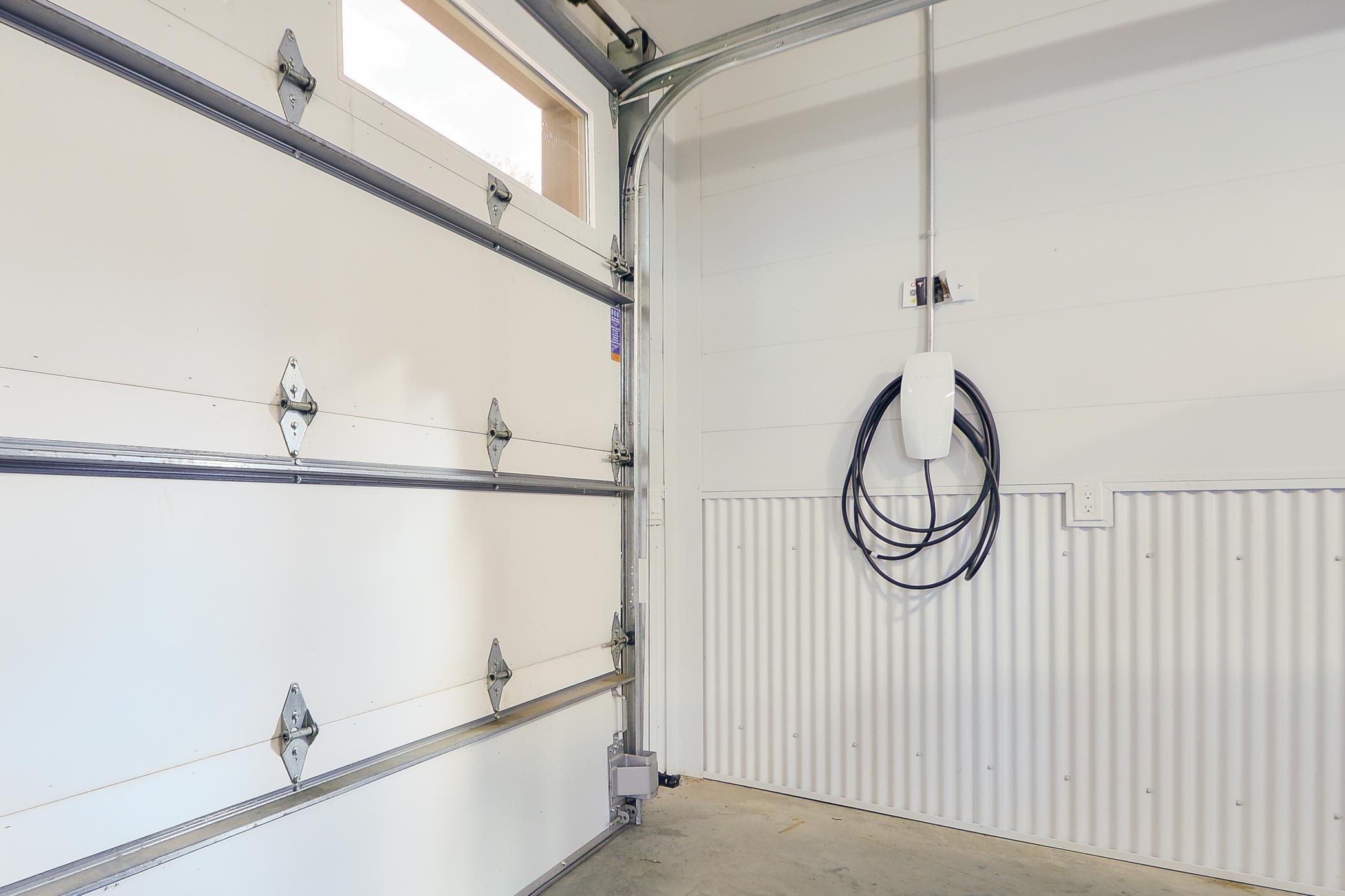 Tesla/EV charging infrastructure installed in garage