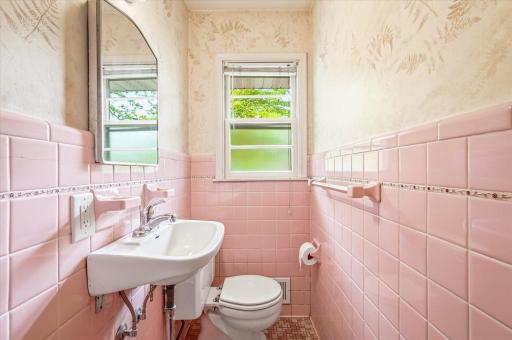 This cutie is a main floor powder room, 1/2 bath just off the back mud hall near the kitchen