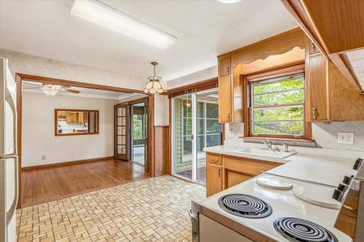 View from the kitchen to the dining room and deck.