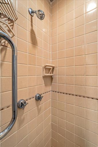 There is a separate shower in the main floor full bath also - complete with original tile