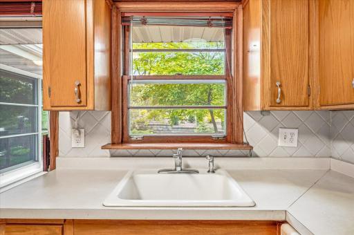 Enjoy the view of shade trees and gardens from the kitchen window.