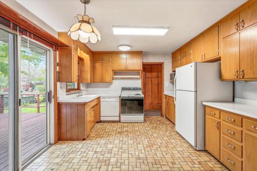 The kitchen is just off the dining room and features a sliding door to the private deck.