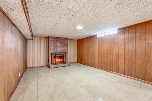 Downstairs this family room is large enough for big comfy furniture/