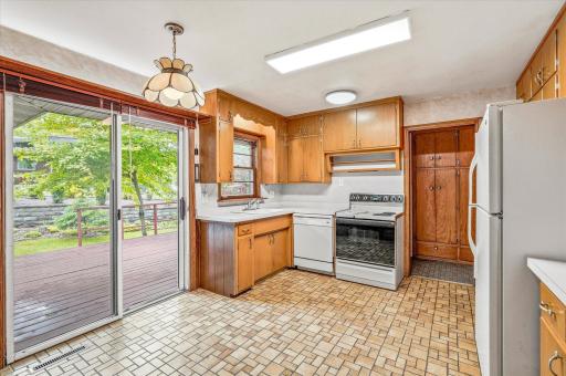 Tile flooring, and a tile backsplash add to this kitchen