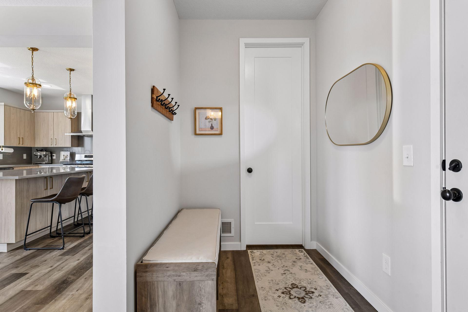 Smartly designed mudroom with walk-in closet adds everyday function, polished storage, and an easy drop zone right where life happens.