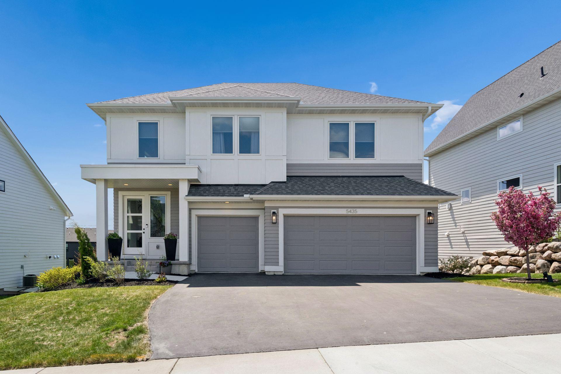 Designed. Pristine. Connected. Modern, stately curb appeal with high-end engineered wood siding, refined architectural detail, and a pristine nearly-new presence.