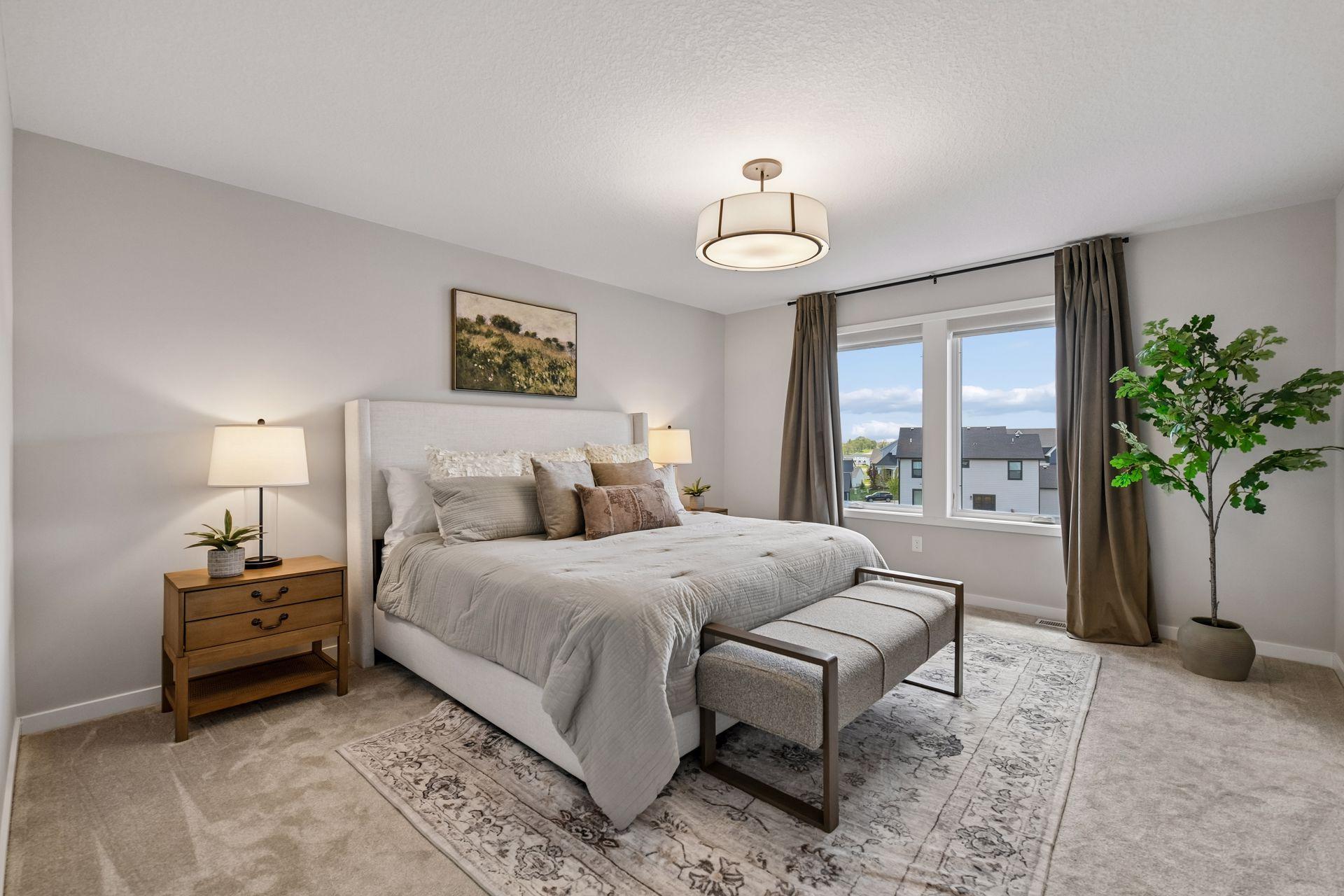 Serene primary suite with soft natural light, generous proportions, and a calm, elevated feel.