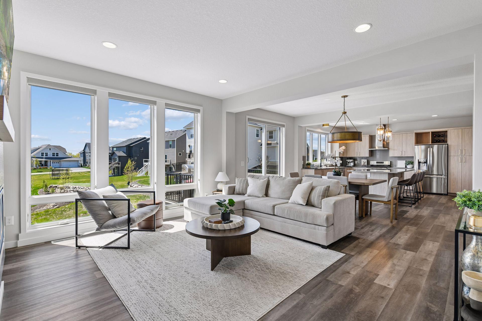 Light-filled gathering room with expansive windows.