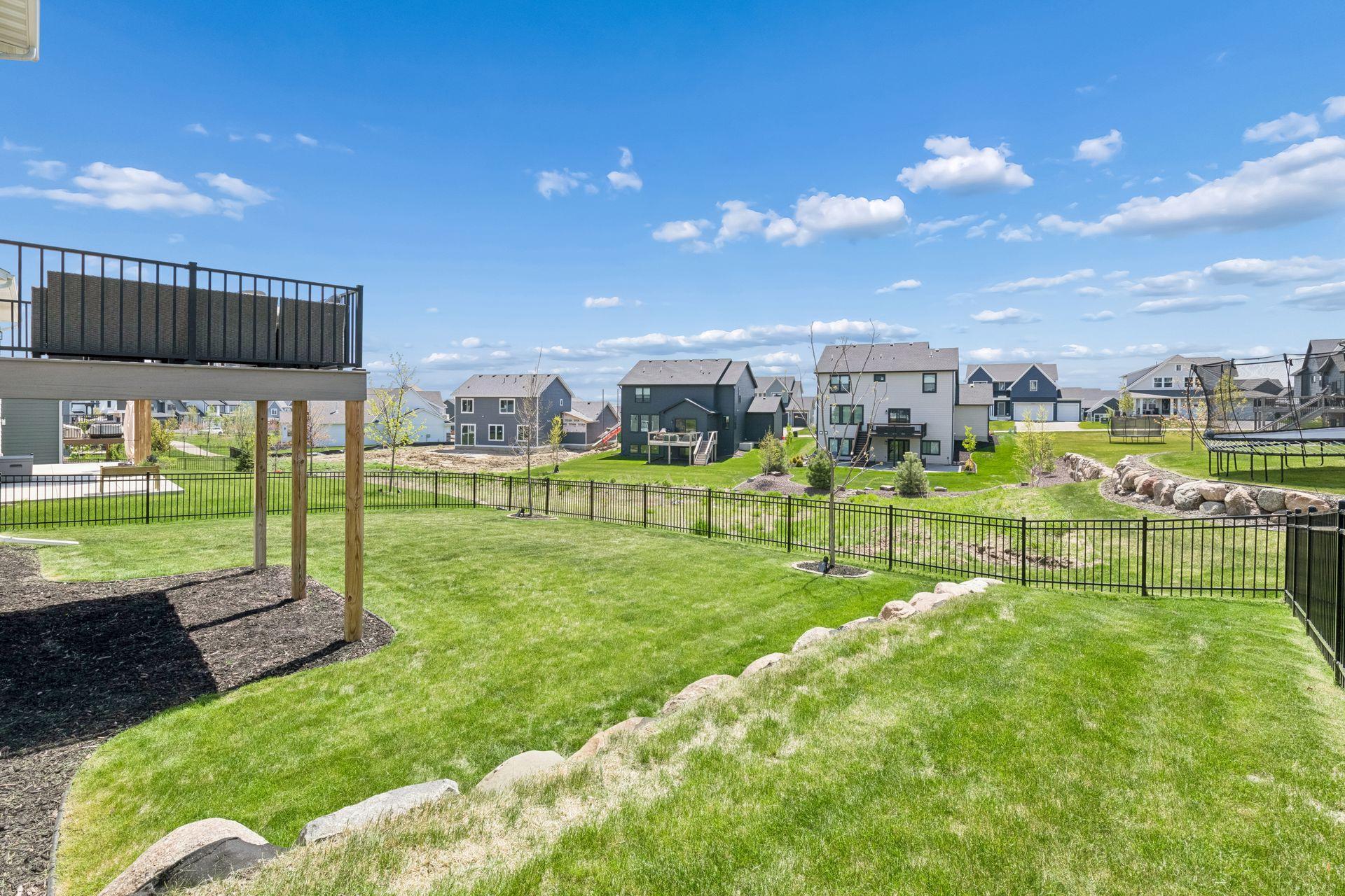 Fenced backyard with flexible outdoor space for everyday living and entertaining.