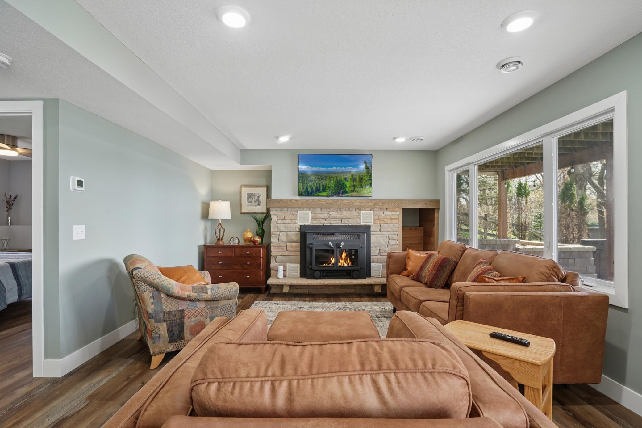Lower level family room with wood burning fireplace