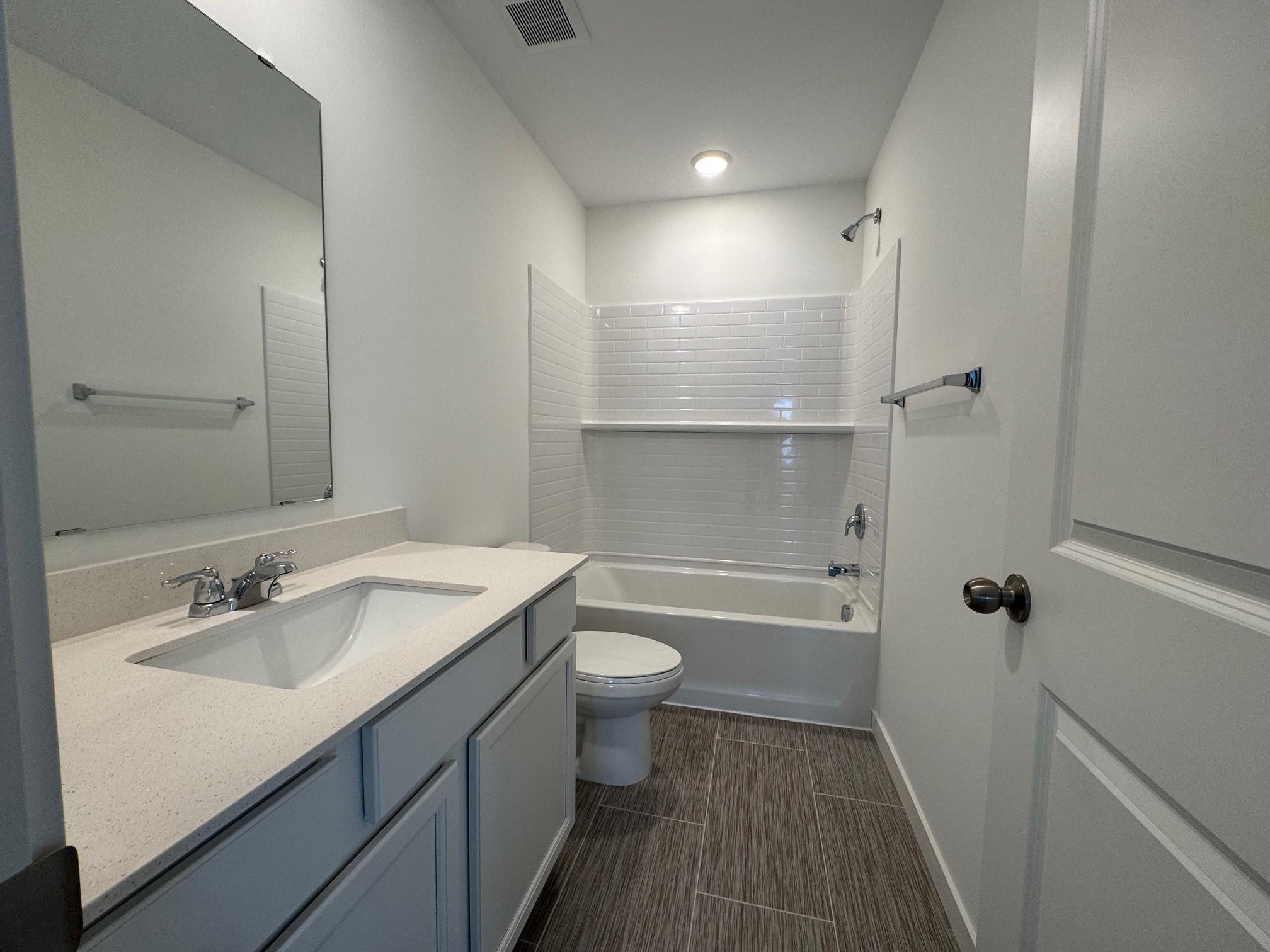 Full Bathroom 2. Photo is of a similar Lowry home.