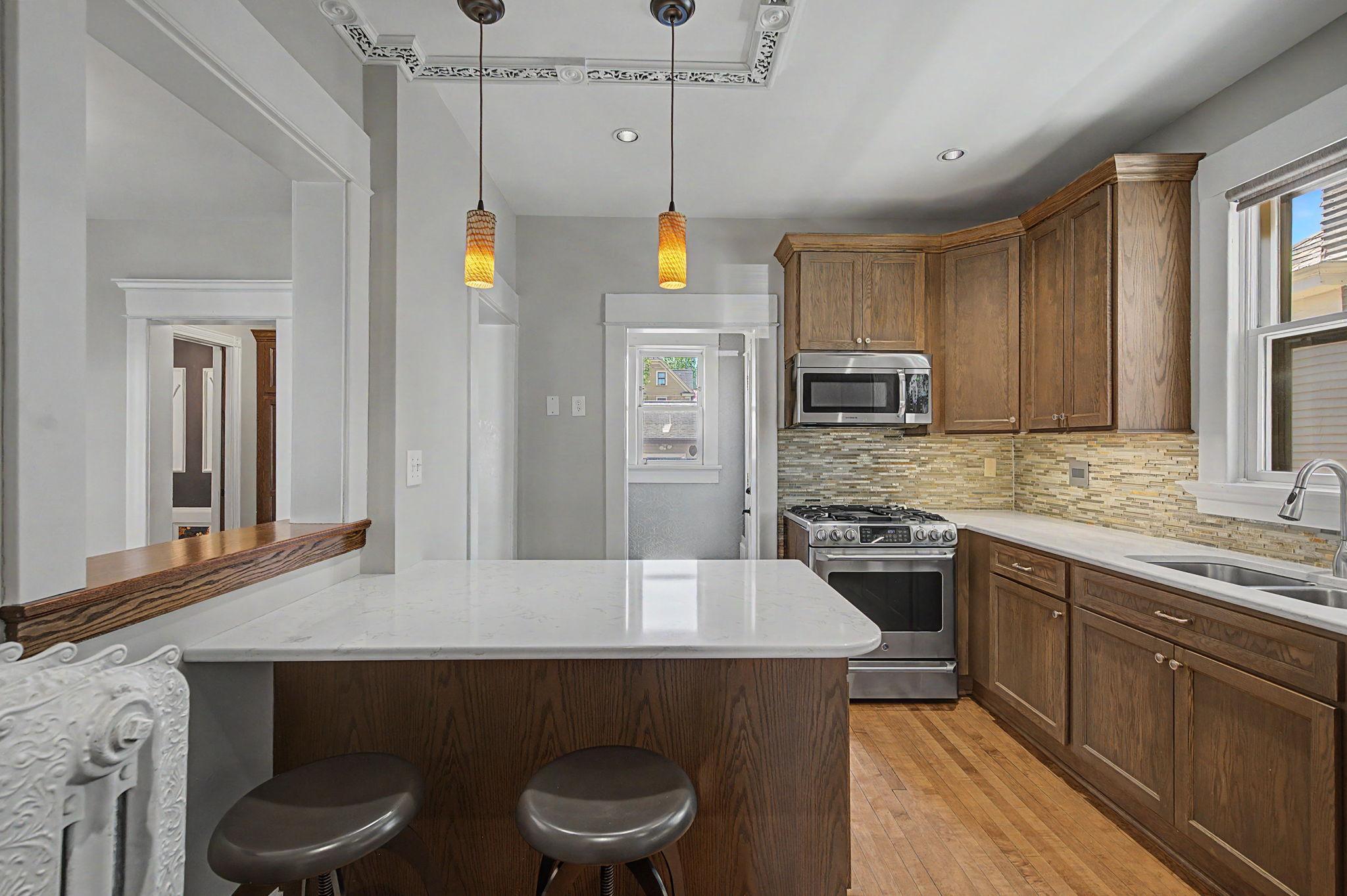 The back door to the home has a mud room area with extra built in cabinets for storage.