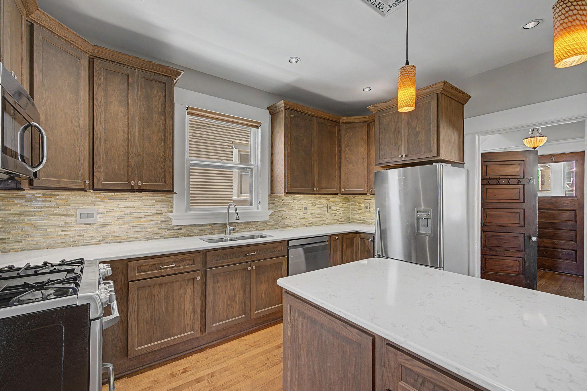 Plenty of kitchen cabinet storage space and a kitchen window over the sink. Dishwasher replaced in 2023.