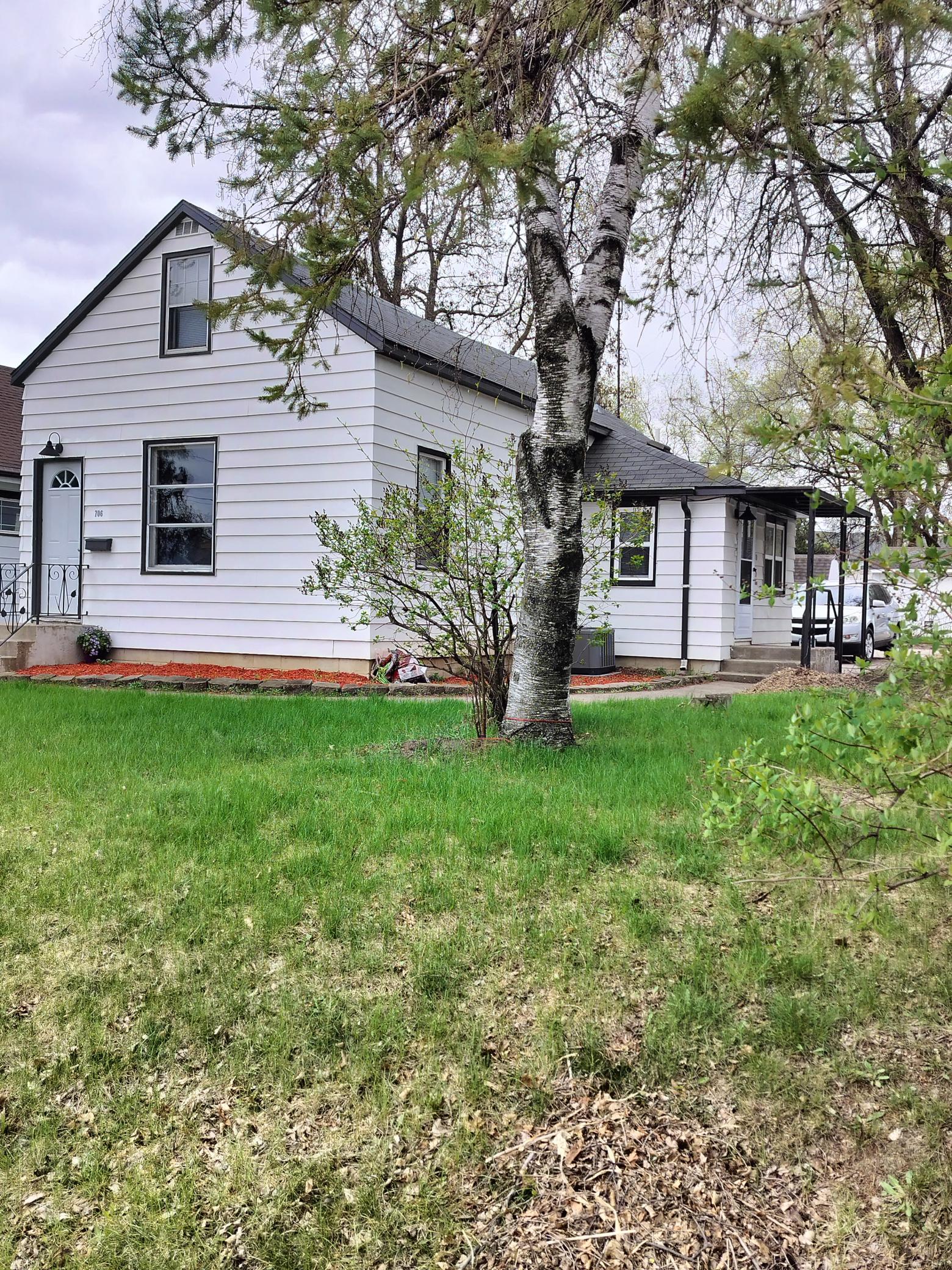 Front yard to side of house.