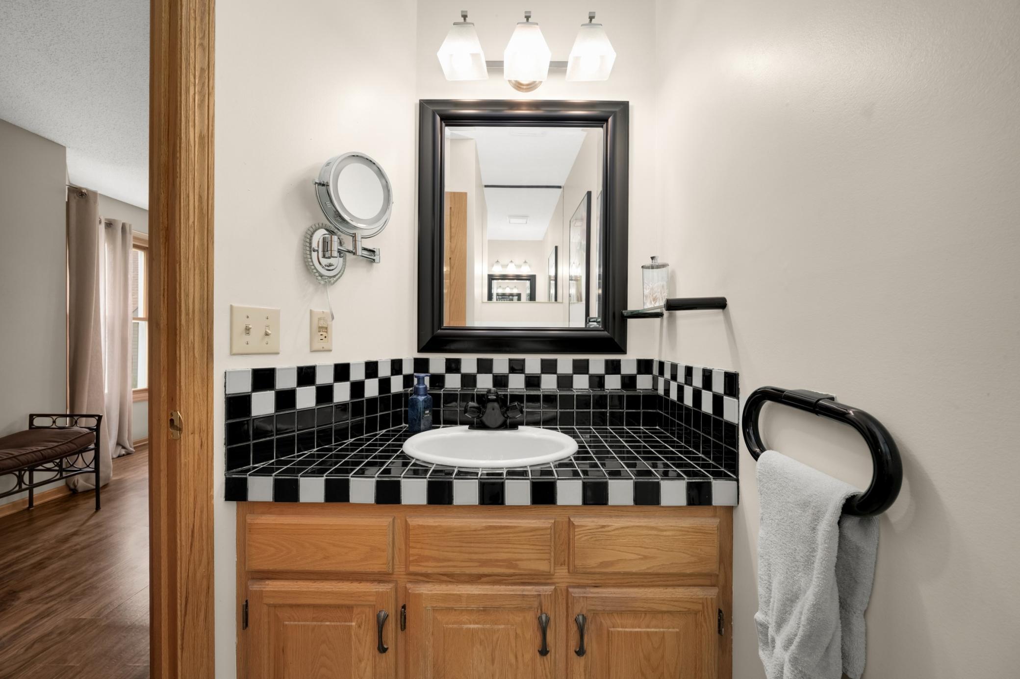 The guest bath is located off the entryway