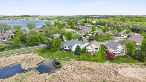 Seller has bubbler for back pond area. Nice garden and flower beds in backyard with 32x13.5 LL paver patio and maintenance free decking with stairs. Hard to find this space when downsizing or wanting ML living walkout. Beautiful custom option!
