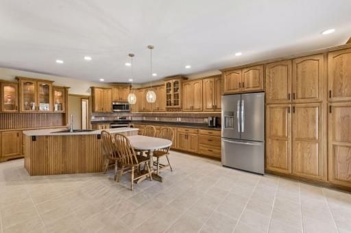 The kitchen is always the heart of the home, and this offers everything! You won't be short of counter space or storage in this kitchen. Cambria countertops, tile backsplash, undermount lighting, pull outs in the drawers and more.