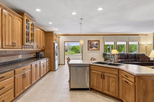 Views into the backyard and 4-season sunroom with deck to lower-level yard. This home offers a ton of sunlight year round.