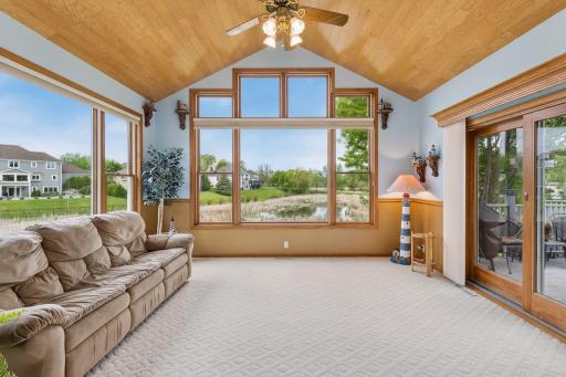 Vibrant sunroom! What an ideal space to feel Lake Waconia from here and all the birds and nature surround. Home has Anderson Windows throughout.