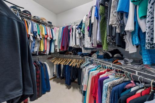 Spacious primary walk in closet in the bathroom area.