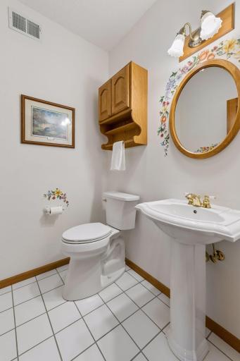Half powder bath on main set off back hall for privacy.