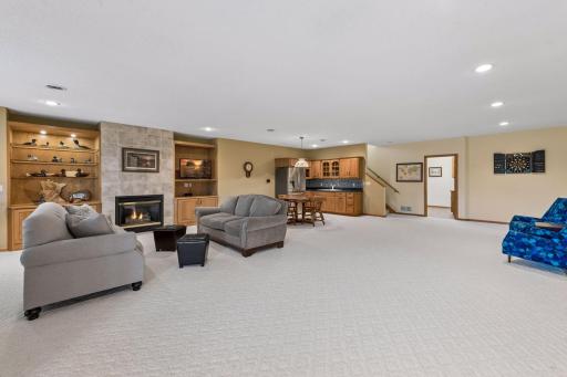 Buyers and guests will enjoy the 2nd gas fireplace in the home with tile surround and more built-ins with accent lighting.