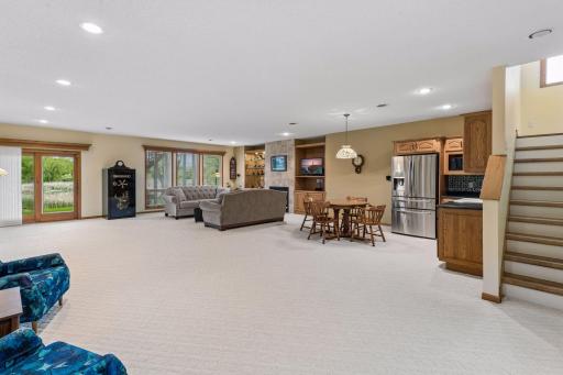 The Lower-level family room with high ceilings, large windows and more is such an incredible space to gather and enjoy. 25x13 with bar area included 25x13.5
