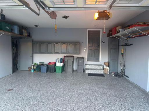 3 car epoxy floors in insulated, heated garage with floor drains. The door you see on left side in photo walks into 3rd stall for car, toys or workshop area.