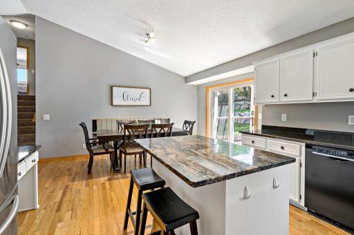 The deck is right off the kitchen for easy indoor/outdoor entertaining and playing!