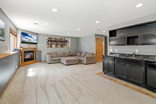 Massive lower level family room complete with wet bar, fireplace and loads of space